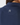 Close-up of a person wearing a navy ribbed golf top, showing the back of the neck and collar with a small white star logo centered on the upper back.