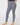 Navy women’s golf leggings with white patterned print and side pockets, shown from the front.
