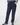 A person wearing dark navy jogger-style golf pants with side pockets, paired with a patterned long-sleeve top and matching patterned socks.