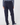 A person shown from the back wearing dark navy golf trousers, a navy and white patterned long-sleeve top, and navy-and-white patterned socks.