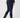A person wearing dark navy fitted golf pants with a vertical dark velvet stripe down the side and a small star detail near the right back pocket, shown from the back.