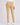 A person shown from the back wearing slim-fit beige golf pants, a white long-sleeve top, and white sneakers.