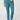 A person wearing slim-fit teal pants with a matching long-sleeve top and teal socks.
