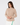 A woman wearing a beige long-sleeve quarter-zip fleece pullover.