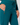 Close-up of a person wearing teal drawstring pants with a zippered pocket and a star-shaped zipper pull, paired with a patterned sweater.