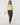 A woman modeling a light lime green long-sleeve mock neck top and brown jogger pants with patterned socks.
