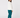 A woman wearing a white long-sleeve golf top, teal sweatpants, and matching teal socks, shown from the back.