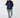 A woman wearing a navy blue half-zip pullover hoodie and matching navy and white patterned leggings.