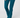A person wearing teal-blue pants and matching golf socks with white toes, shown from the waist down.
