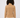 Women wearing caramel ribbed golf sweater paired with white pants, back view.