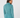 A woman shown from the back wearing a matching teal long-sleeve quarter-zip top and high-waisted trousers with a small white star logo on the upper back.