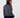 A woman shown from the back wearing the Donna navy blue knit golf sweater with a white geometric pattern and a solid navy mock neck, ribbed hem, and cuffs, paired with navy trousers.
