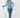 A woman modeling a teal and white patterned long-sleeve button-up shirt, matching teal pants, a headband, and socks, while holding a golf club.