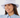 A smiling woman wearing a light lavender bucket hat with a dark embroidered star on the front, paired with a light blue collared blouse.