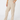 A person wearing beige heathered lounge pants with a relaxed straight-leg fit, paired with a tan long-sleeve top, shown from the waist down.