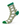 A single crew ladies golf sock with a white base covered in a green, brown, and purple woven-look pattern, finished with solid green cuff, heel, and toe.