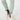 Beige women’s winter golf boots with black side panels and white soles, styled with patterned golf leggings.