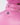 Close-up of a pink puffer jacket with a high collar and silver drawcord, worn by a person wearing a matching pink knit beanie. A circular black logo patch with a white star is visible on the jacket.