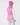 A person shown from the back wearing a bright pink puffer vest over a white long-sleeve top, a matching pink knit beanie, and patterned leggings.