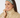 Smiling woman wearing Felicity Snood in Noughty Green lattice print.