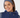Fizz Snood in Megabyte Navy print worn as headband with matching navy golf vest, front view