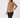 A woman modeling a tan long-sleeve quarter-zip fleece pullover against a plain light gray studio background.