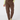 A person wearing brown jogger-style pants with a drawstring waist, side pockets, and zippered details, paired with a light yellow-green top and patterned socks, front view.