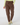 A person wearing brown jogger-style pants with a drawstring waist, side pockets, and zippered details, paired with a light yellow-green top and patterned socks, front view.
