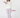 A woman modeling a two-piece loungewear set consisting of a white long-sleeve sweatshirt and lavender polka-dot leggings, holding light purple dumbbells.