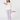 A woman modeling a two-piece loungewear set consisting of a white long-sleeve sweatshirt and lavender polka-dot leggings, holding light purple dumbbells.
