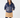 Navy women’s padded zip-up golf jacket with side pockets, styled with a caramel winter golf skirt.