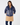 Navy women’s padded zip-up golf jacket with side pockets, styled with a caramel winter golf skirt.