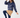 Navy women’s padded golf jacket styled with a caramel winter golf skirt and navy tights.