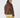 A woman shown from the back wearing a brown sherpa fleece jacket with smooth brown paneling, a patterned headband, and patterned leggings.