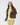 A woman modeling a brown sherpa fleece zip-up jacket over a light green mock-neck top and matching patterned leggings and headband.