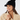 Black women’s ribbed golf beanie with visor, pom-pom and circular star logo, shown on a model.