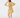 Woman wearing a caramel and parchment color-block ribbed knit top with a caramel golf skort, shown from the front.