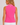 A woman shown from the back wearing a sleeveless bright pink polo shirt with a small white star logo on the upper back and a white-and-pink striped collar, paired with white pants.