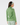 Sage green women’s quarter-zip golf pullover with subtle star print, shown from the back.
